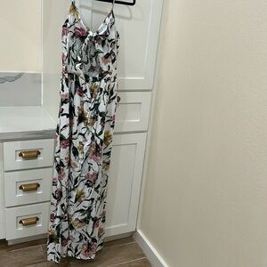 Floral maxi with tie front and opening in the center midriff area.